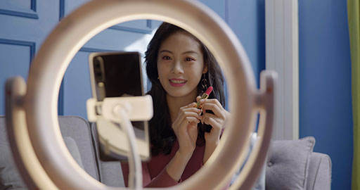 Female influencer live-streaming a product sale