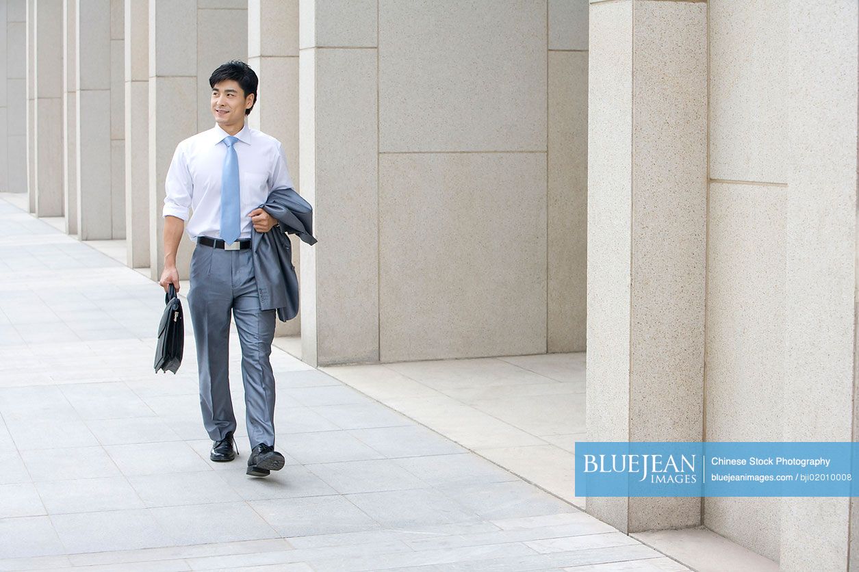 Chinese businessman walking confidently