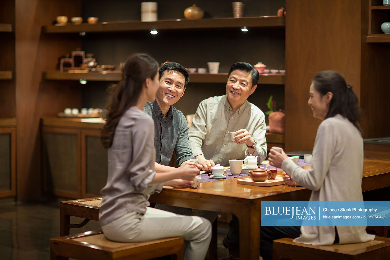 Chinese friends drinking tea together