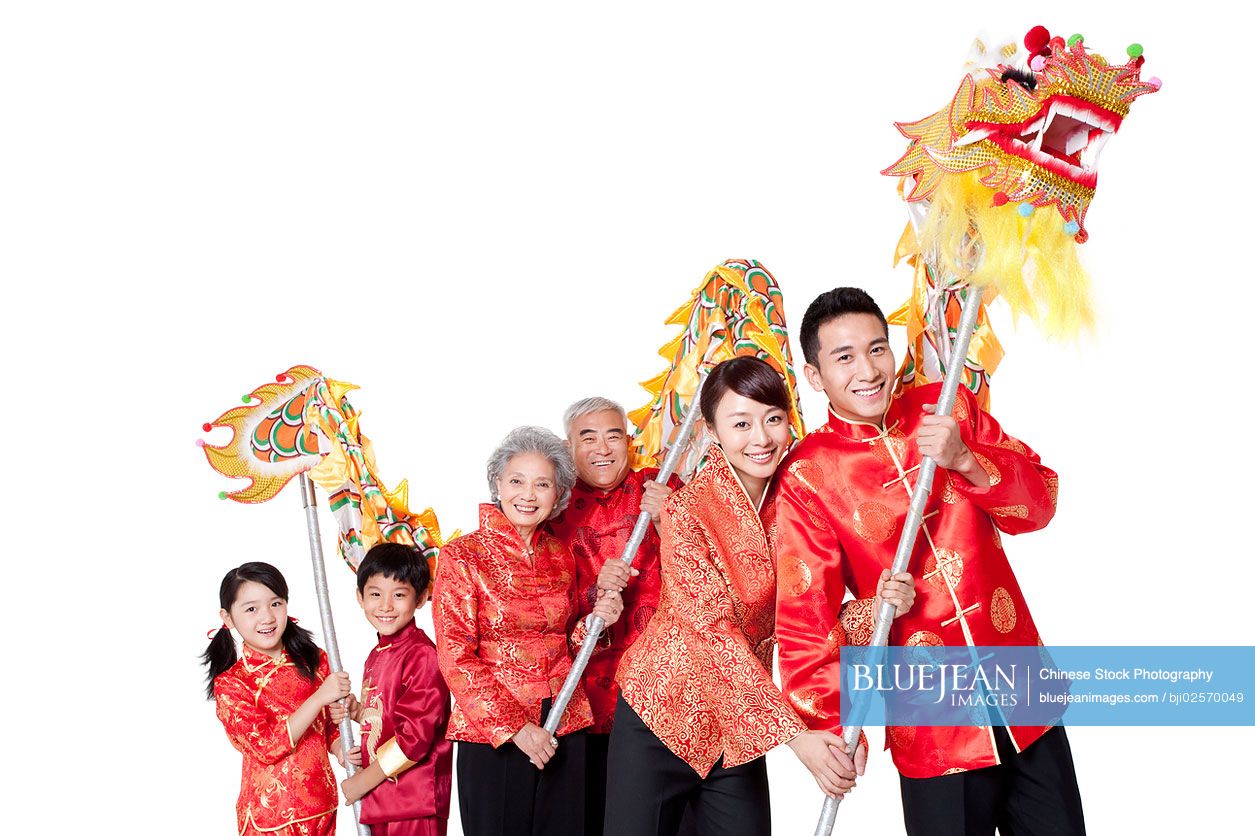 Family Dressed in Traditional Clothing Celebrating Chinese New  Year-High-res stock photo for download