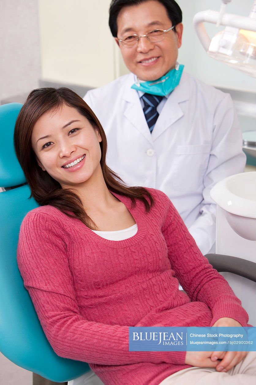 Chinese dentist and patient in dental clinic