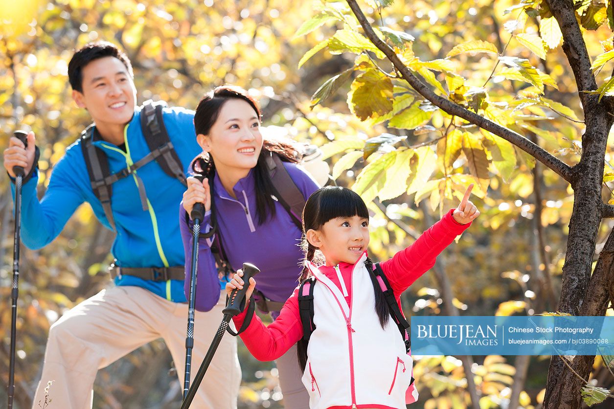 Happy Chinese family hiking