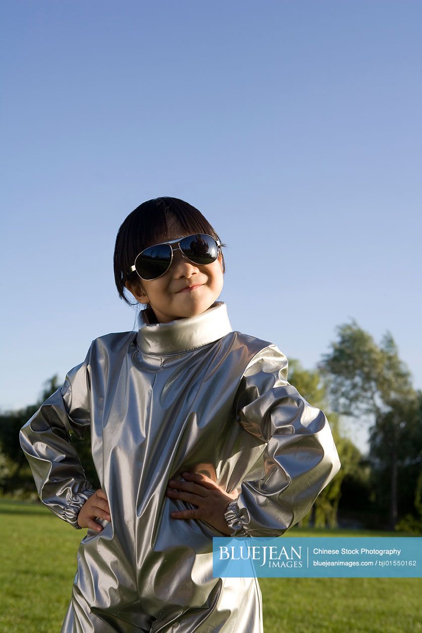 Young Chinese girl playing astronaut