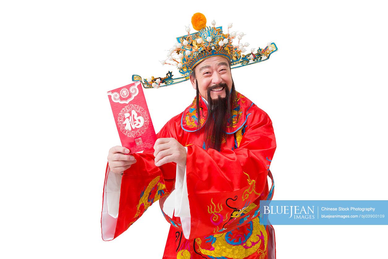 Chinese God of Wealth with red packet celebrating Chinese New Year