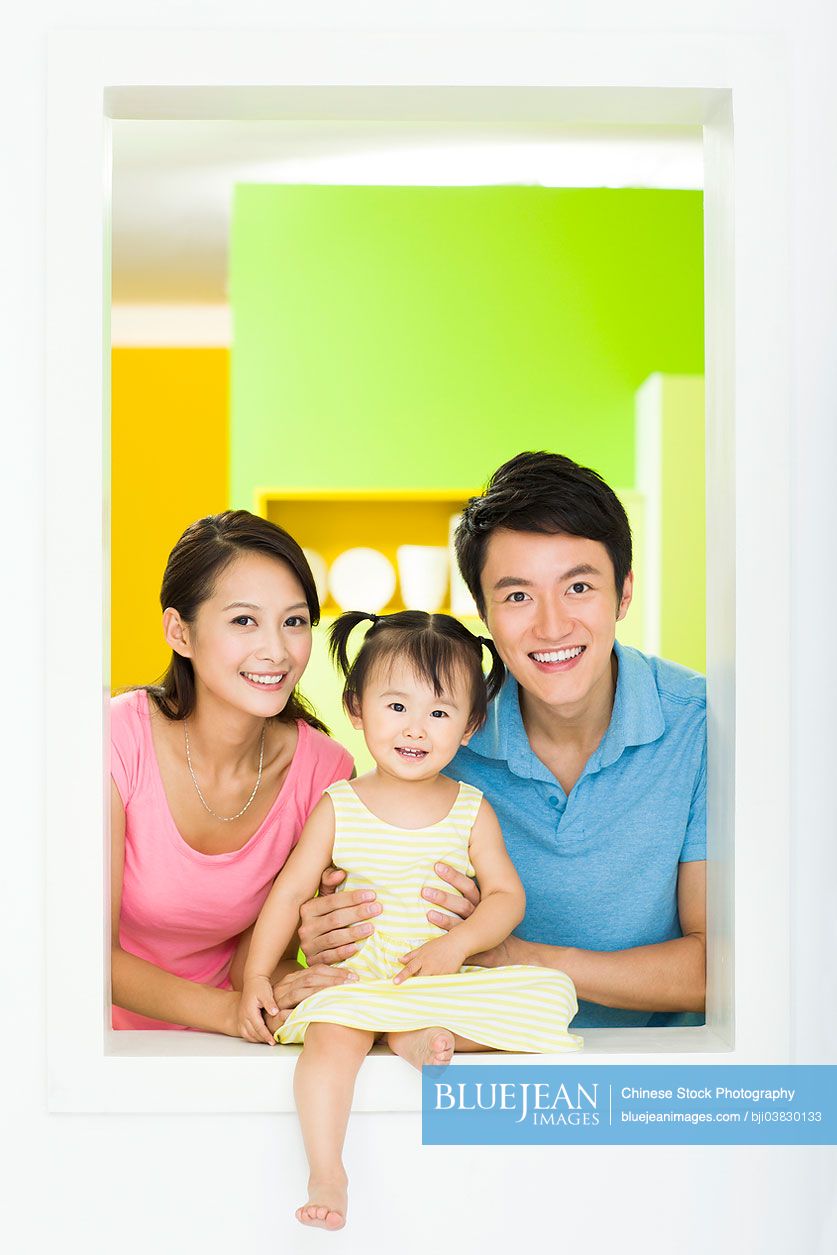 Portrait of happy young Chinese family
