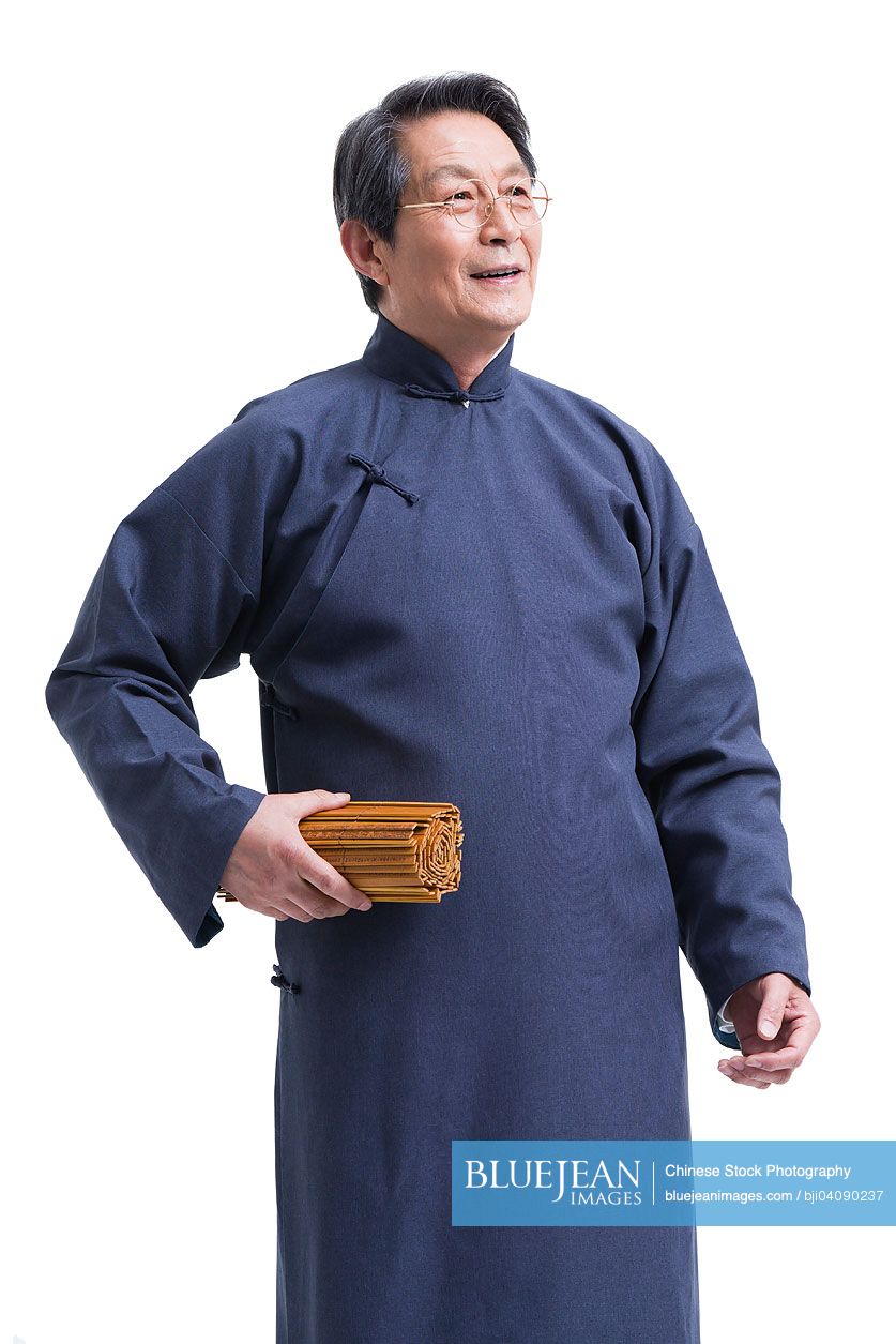 Senior Chinese teacher in traditional clothing with bamboo slips
