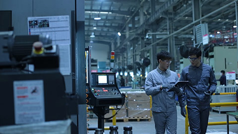 Young Chinese engineers working in factory,HD