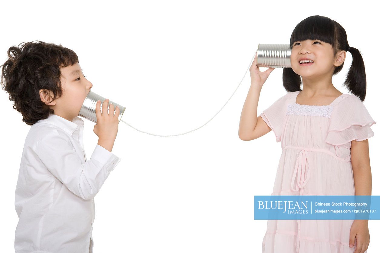 Chinese kids playing with a tin-phone