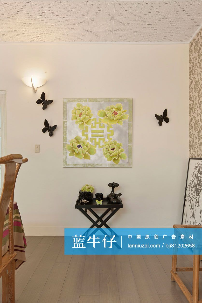 Artifacts on a side table against decorated wall at home