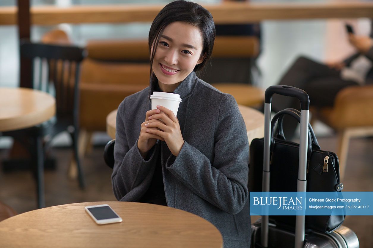 Chinese businesswoman waiting in airport