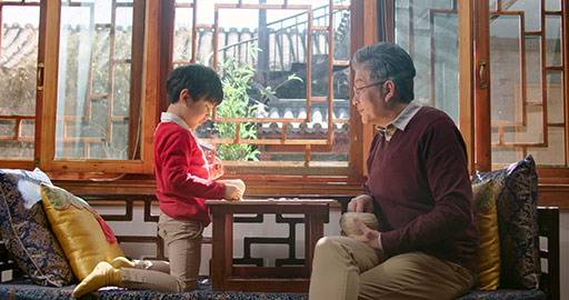 Happy Chinese grandfather and grandson playing the game of go,4K