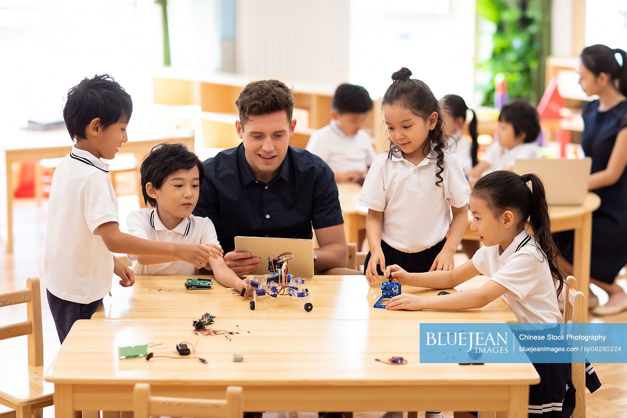 Children learning coding in classroom