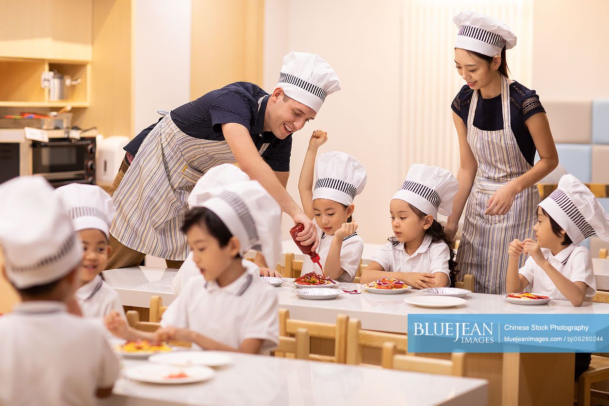 Children learning cooking in classroom