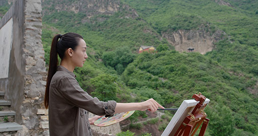 Young Chinese woman painting outdoors,4K