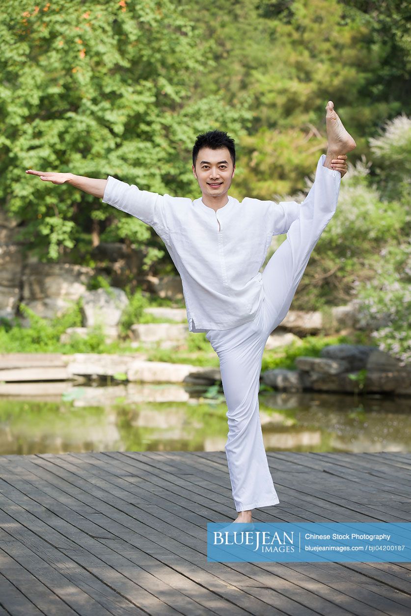 Young Chinese man practicing yoga