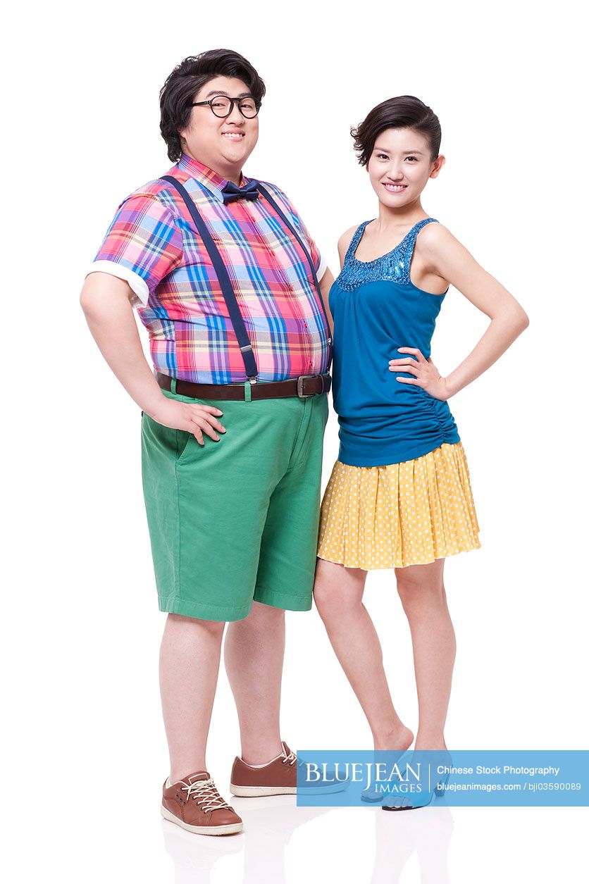 Overweight young Chinese man with slim young woman