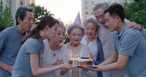 Young Chinese nurse assistants celebrating birthday with seniors,4K