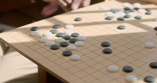 Chinese father and son playing the game of go,4K