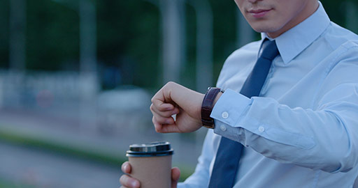 Young Chinese businessman checking the time,4K