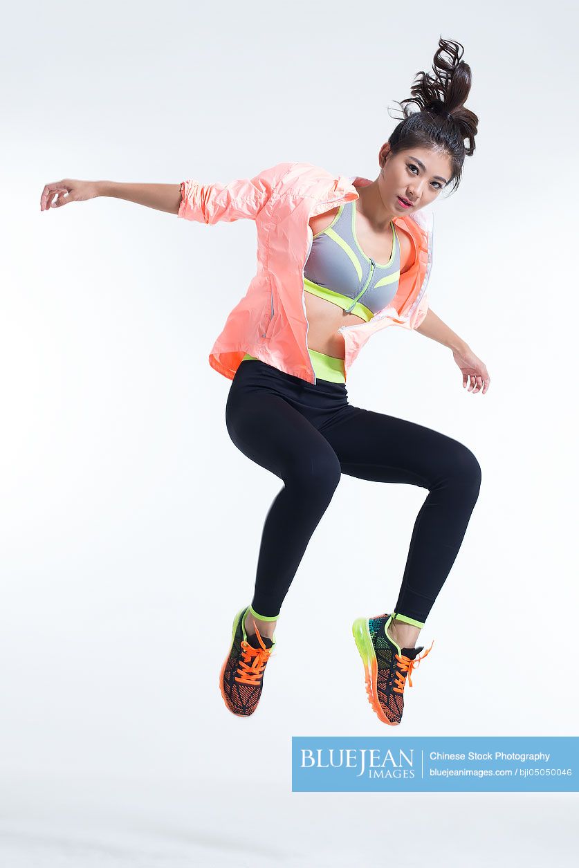 Young Chinese female athlete jumping