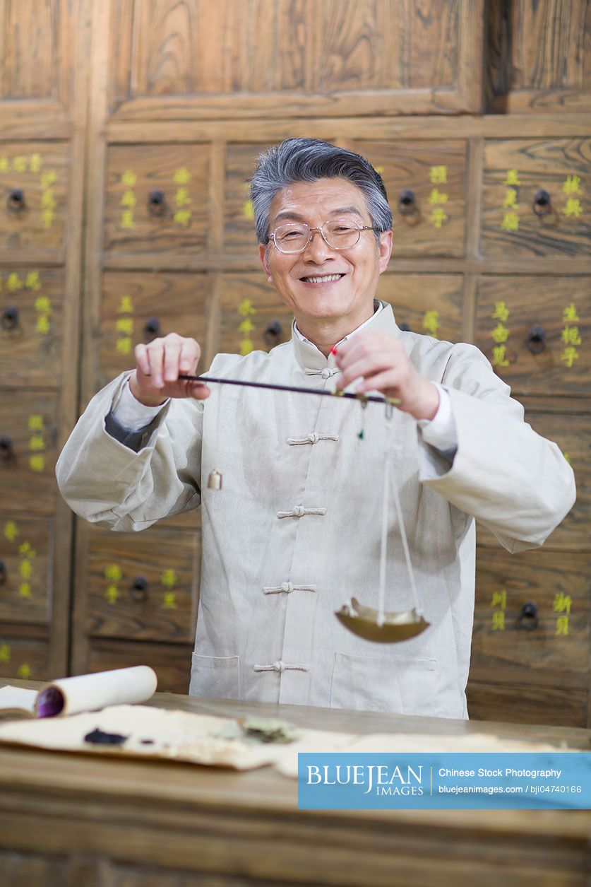 Senior Chinese doctor fill the prescription
