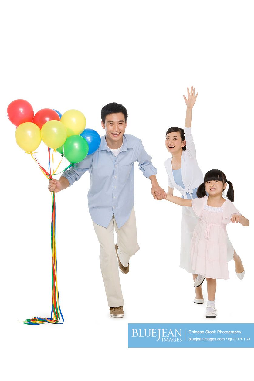 Portrait of Chinese family with balloons