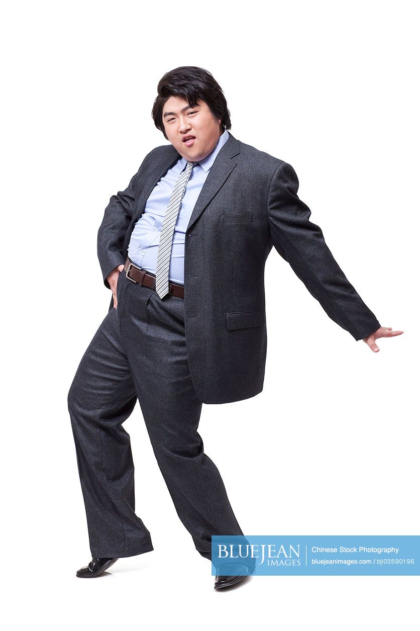 Happy overweight businessman dancing
