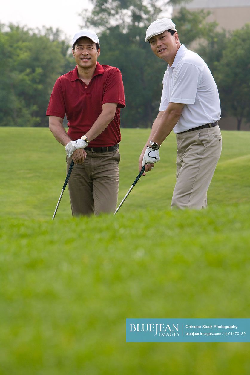 Two Chinese golfers on the course