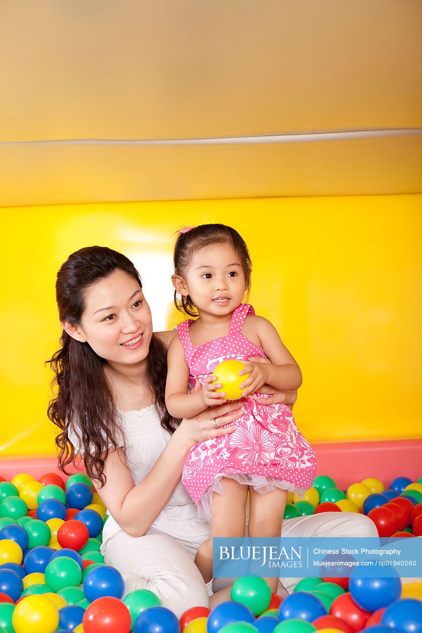 Chinese mother playing with daughter