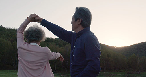 Happy senior Chinese couple dancing outdoors,4K