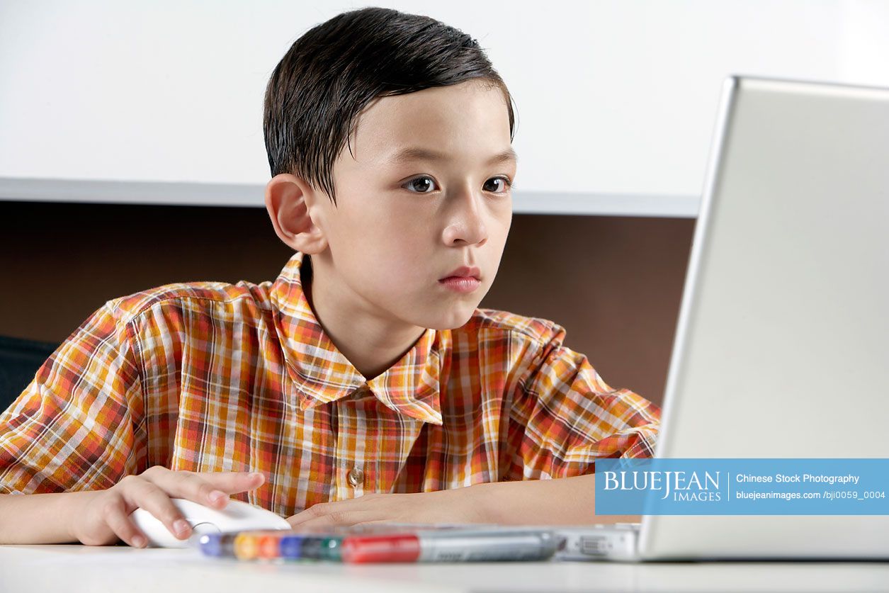 Boy Using Laptop Computer