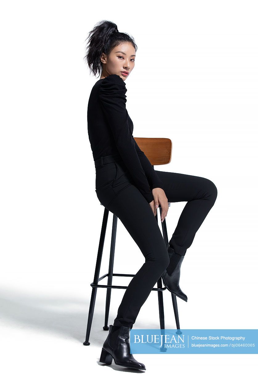 Studio shot of fashionable young Chinese woman