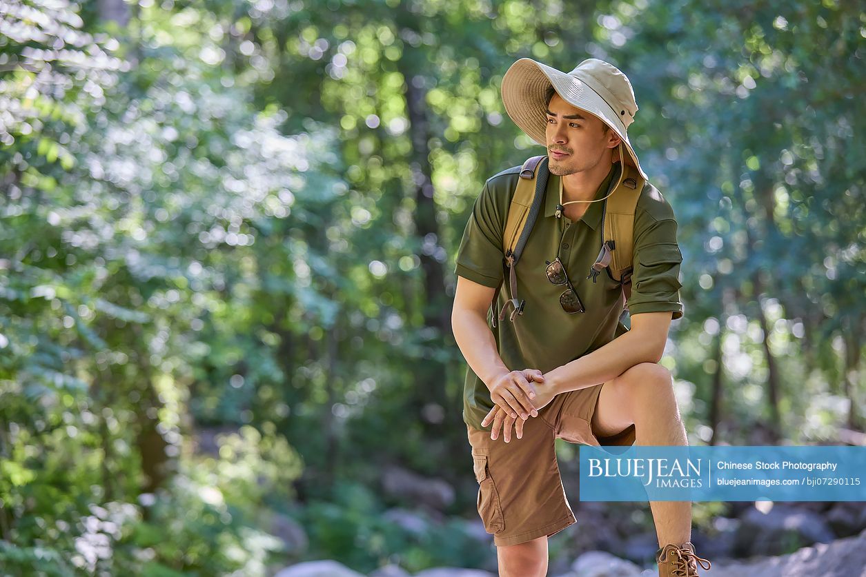 Man hiking through the serene beauty of nature