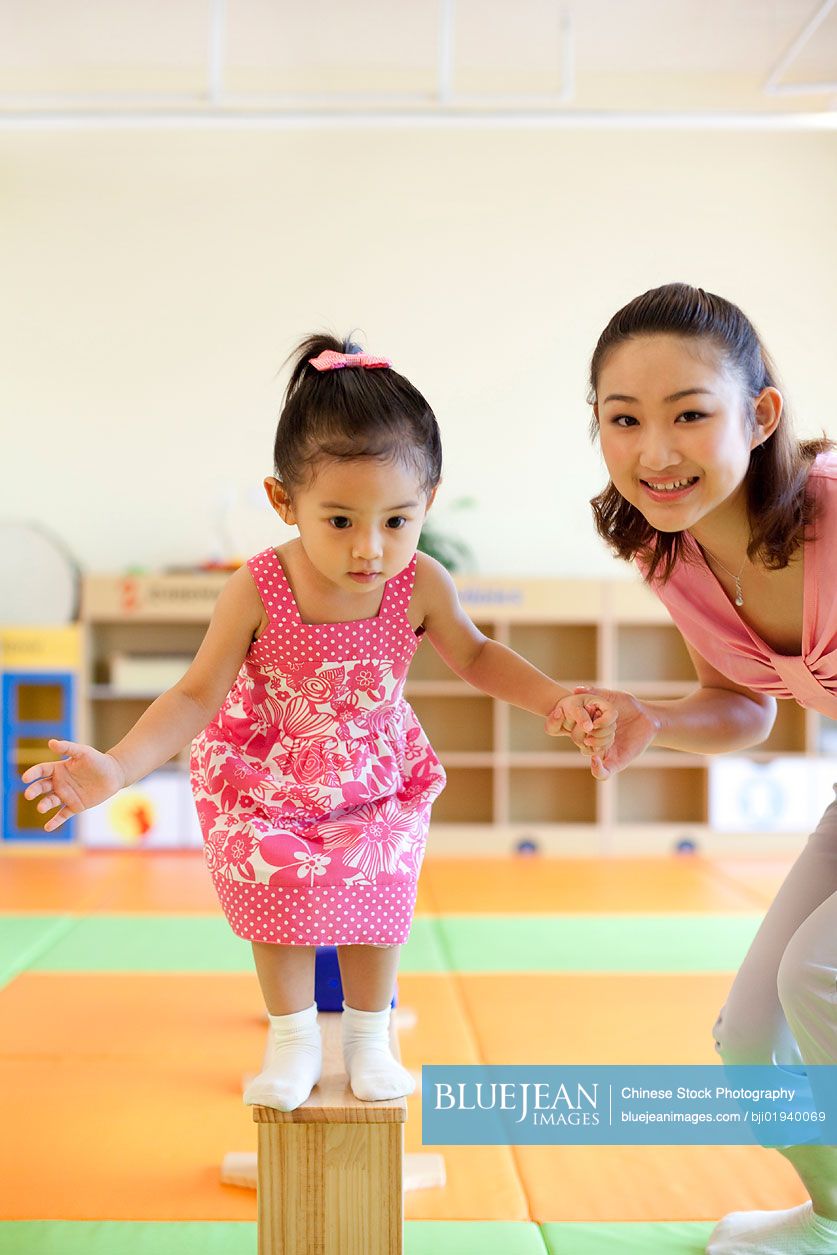 Chinese mother playing with daughter