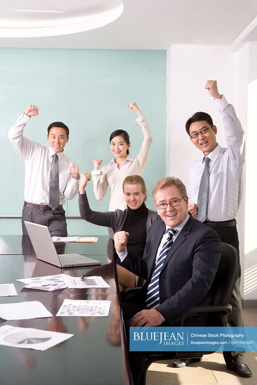 Businesspeople cheering