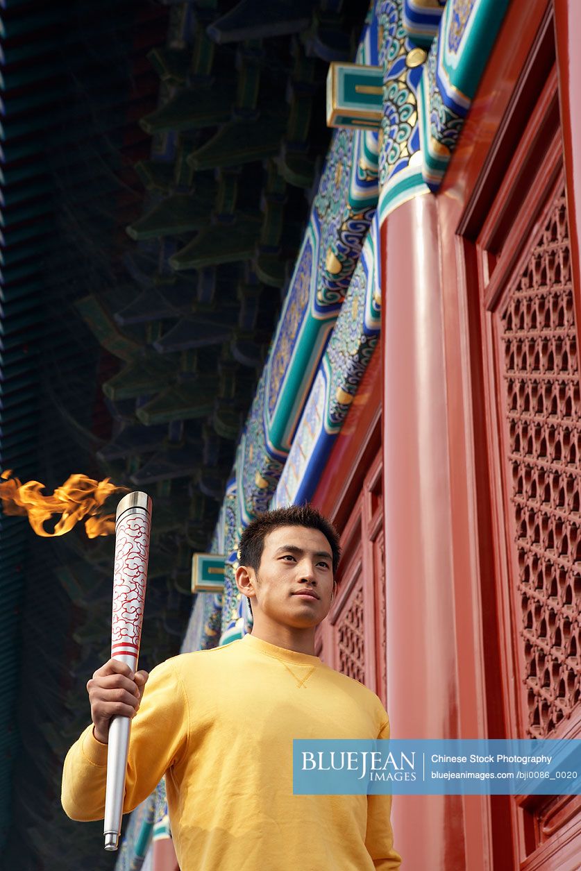 Chinese athlete carrying Olympic flame