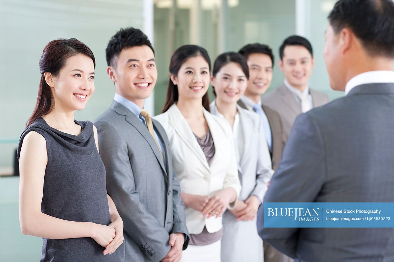 Cheerful Chinese business team having a meeting