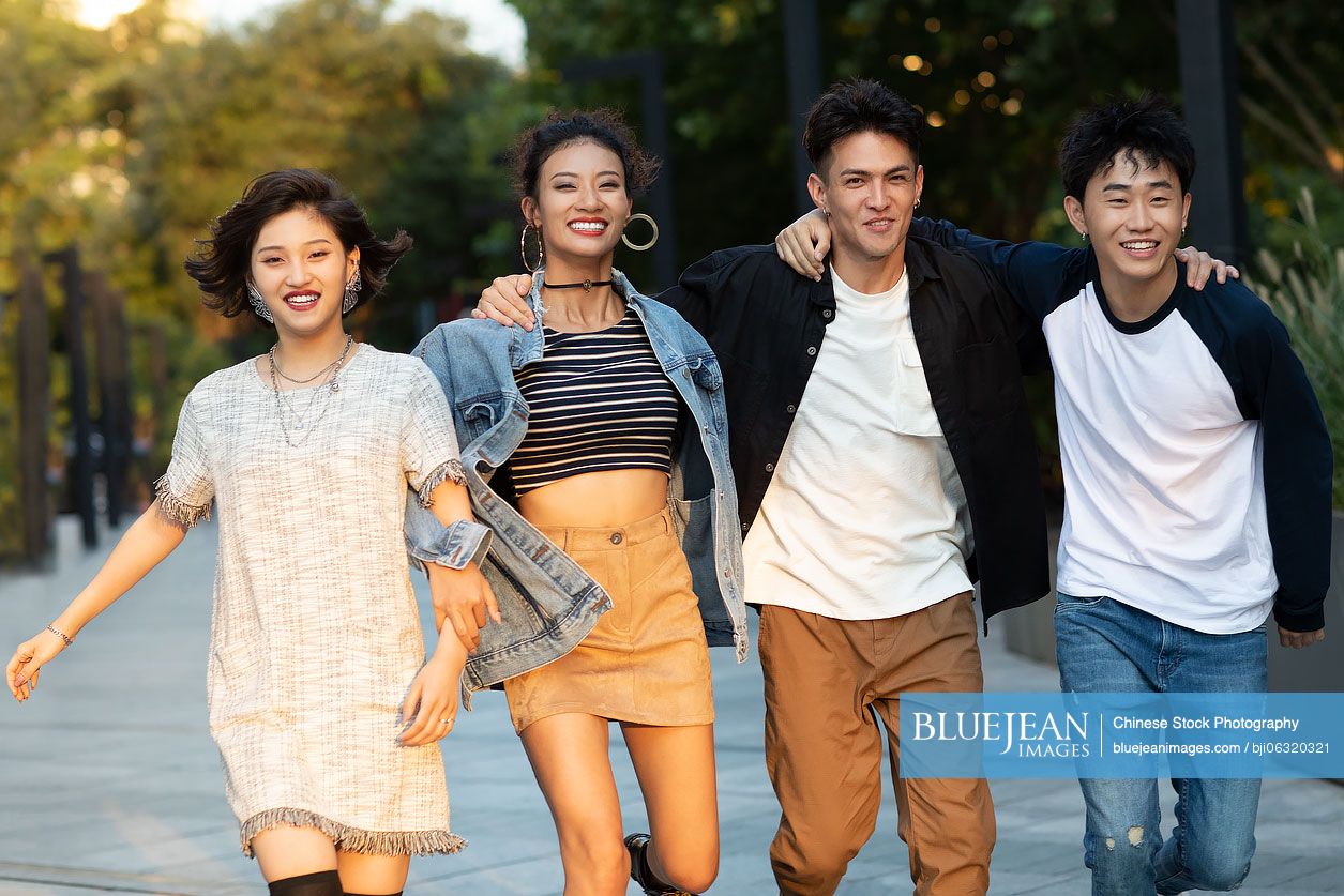 Fashionable young Chinese people having fun on street
