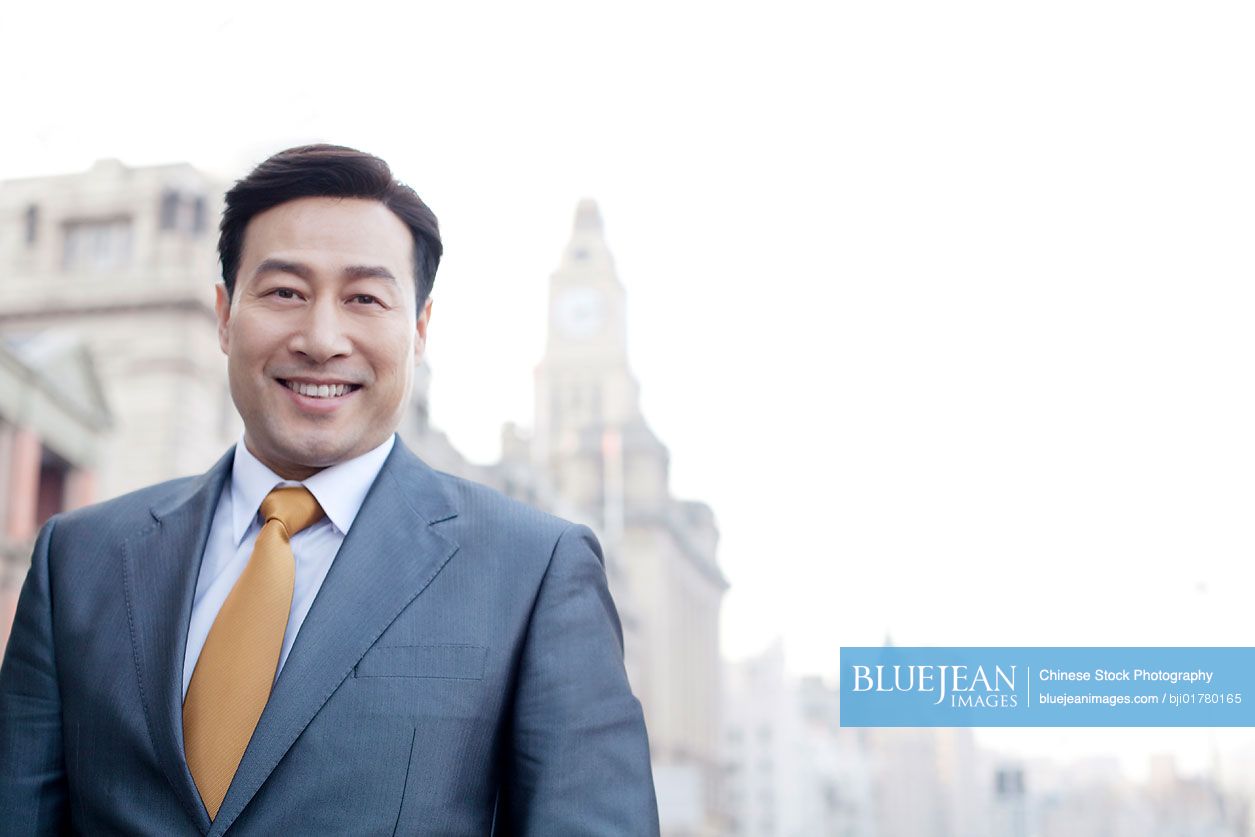 Portrait of Chinese businessman on the Bund in Shanghai