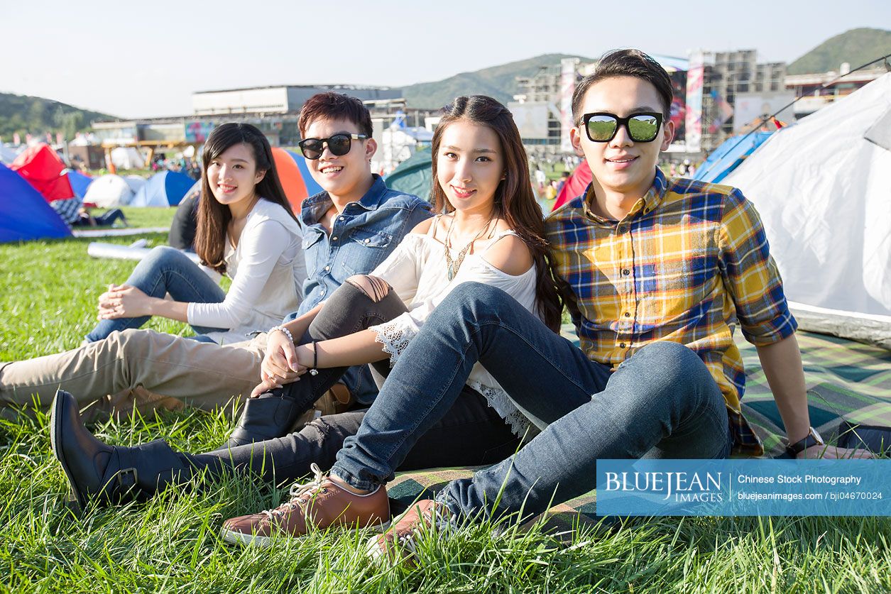 Happy Chinese friends at music festival