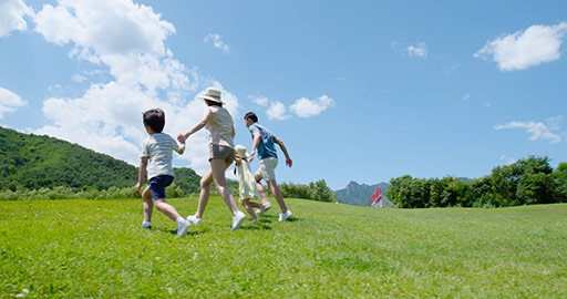 Happy young Chinese family running outdoors,4K