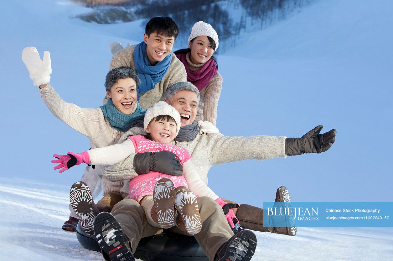 Big Chinese family having fun in snow