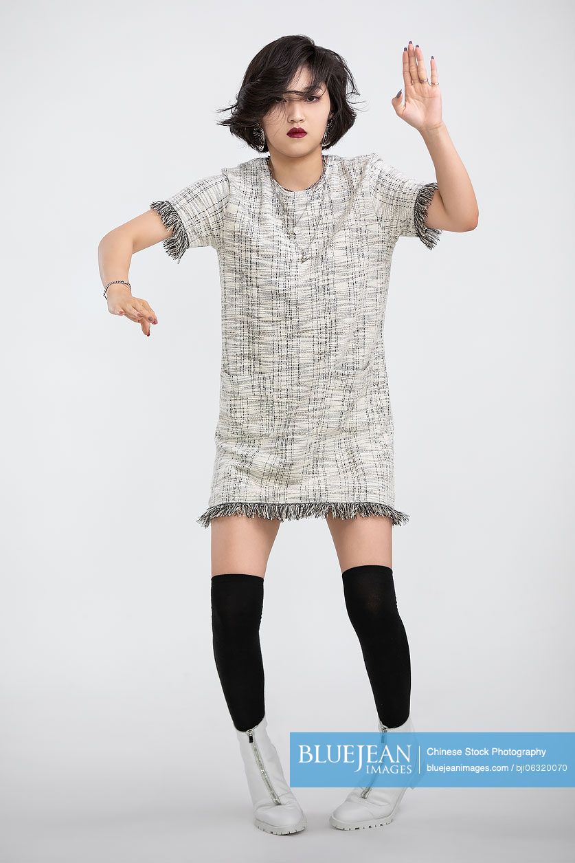 Cool young Chinese woman dancing