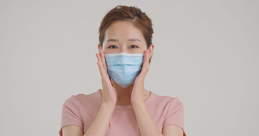 Young Chinese woman wearing surgical mask,4K