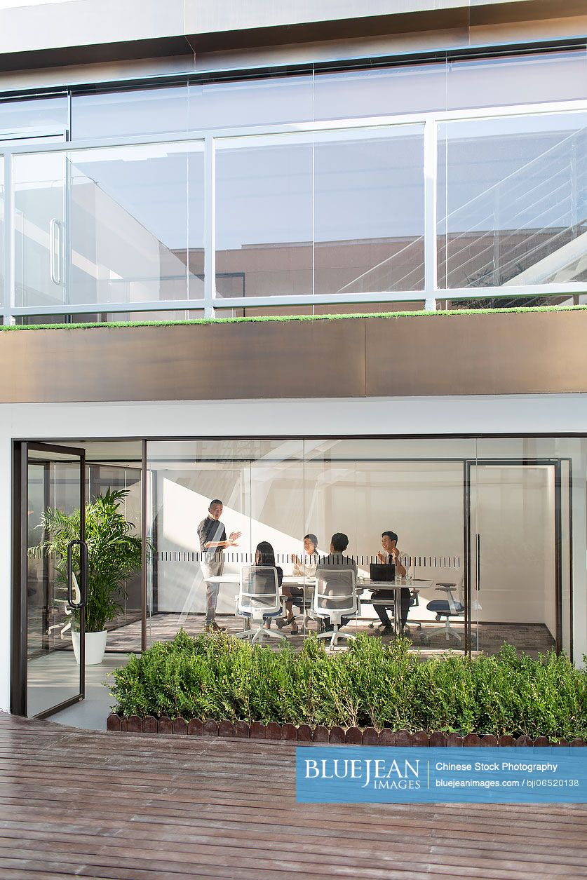 Chinese business people having meeting in board room