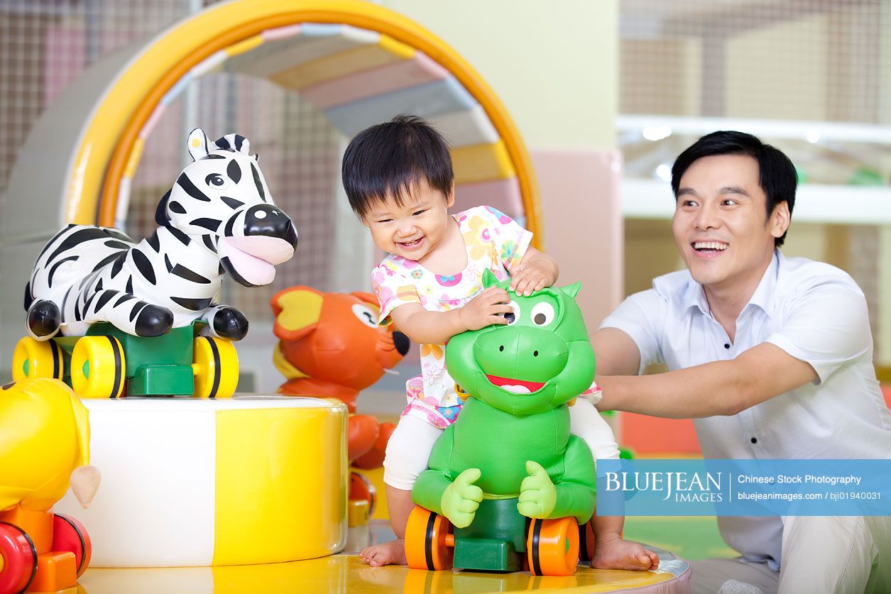 Chinese father playing with daughter