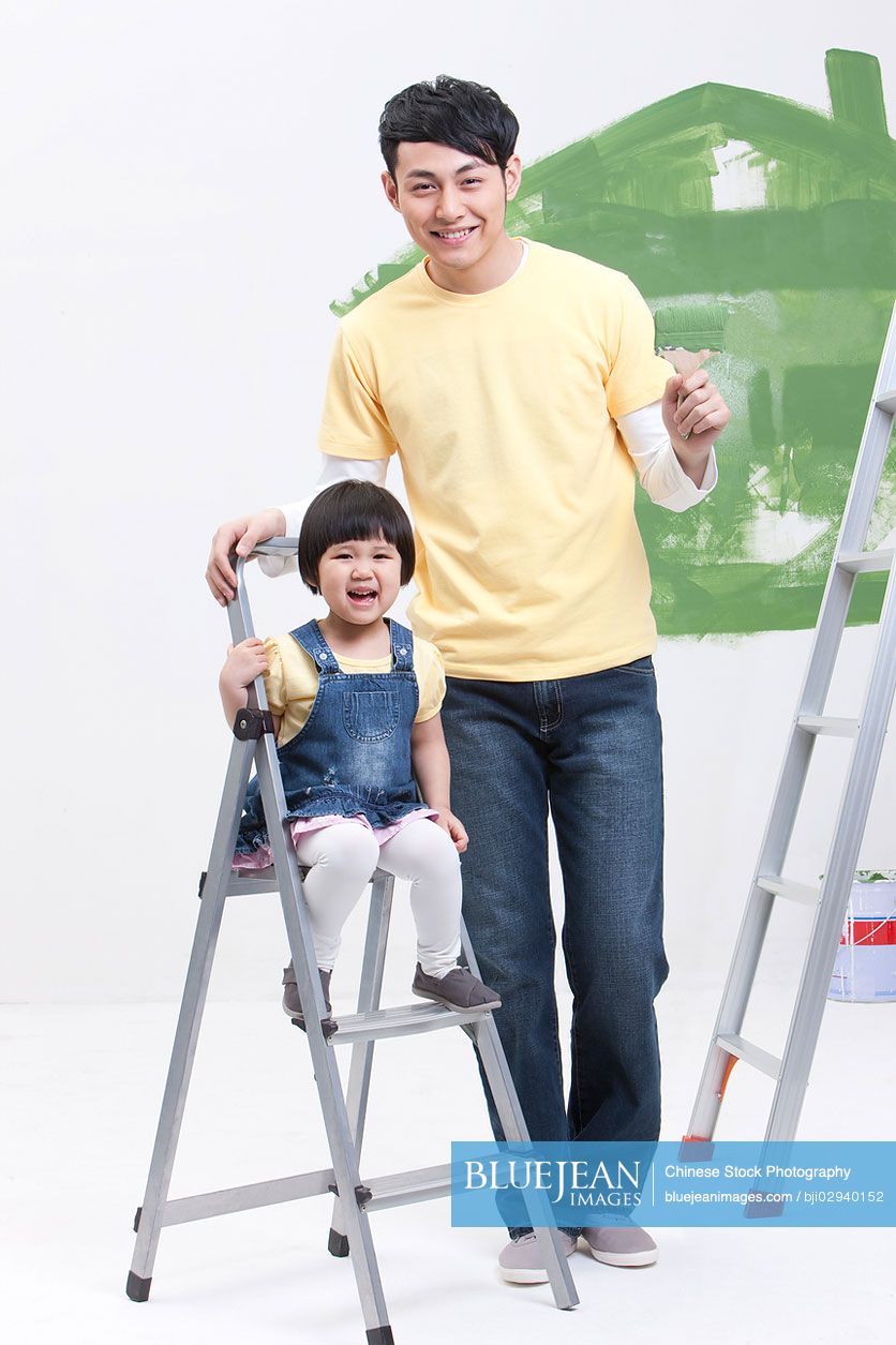 Chinese father and daughter doing diy home improvement