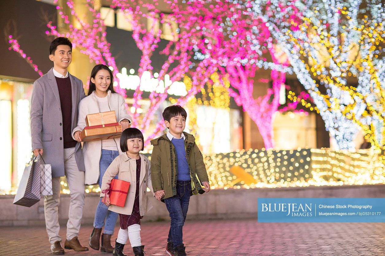 Cheerful young family shopping for Chinese new year