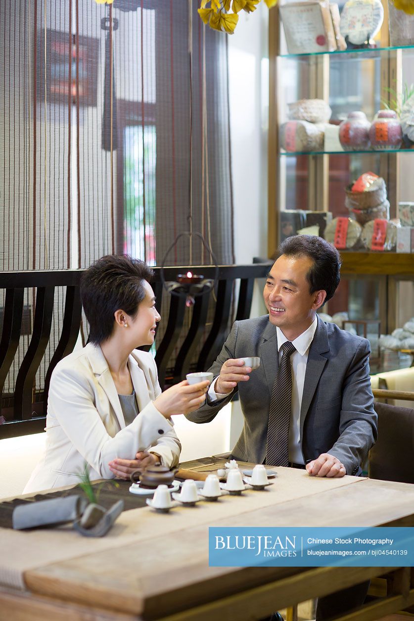 Chinese business person drinking tea in tea room