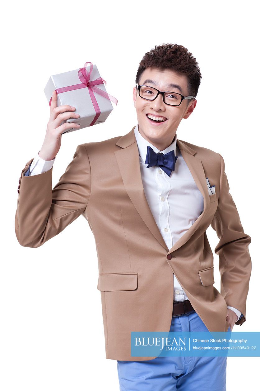 Fashionable Chinese businessman with a gift